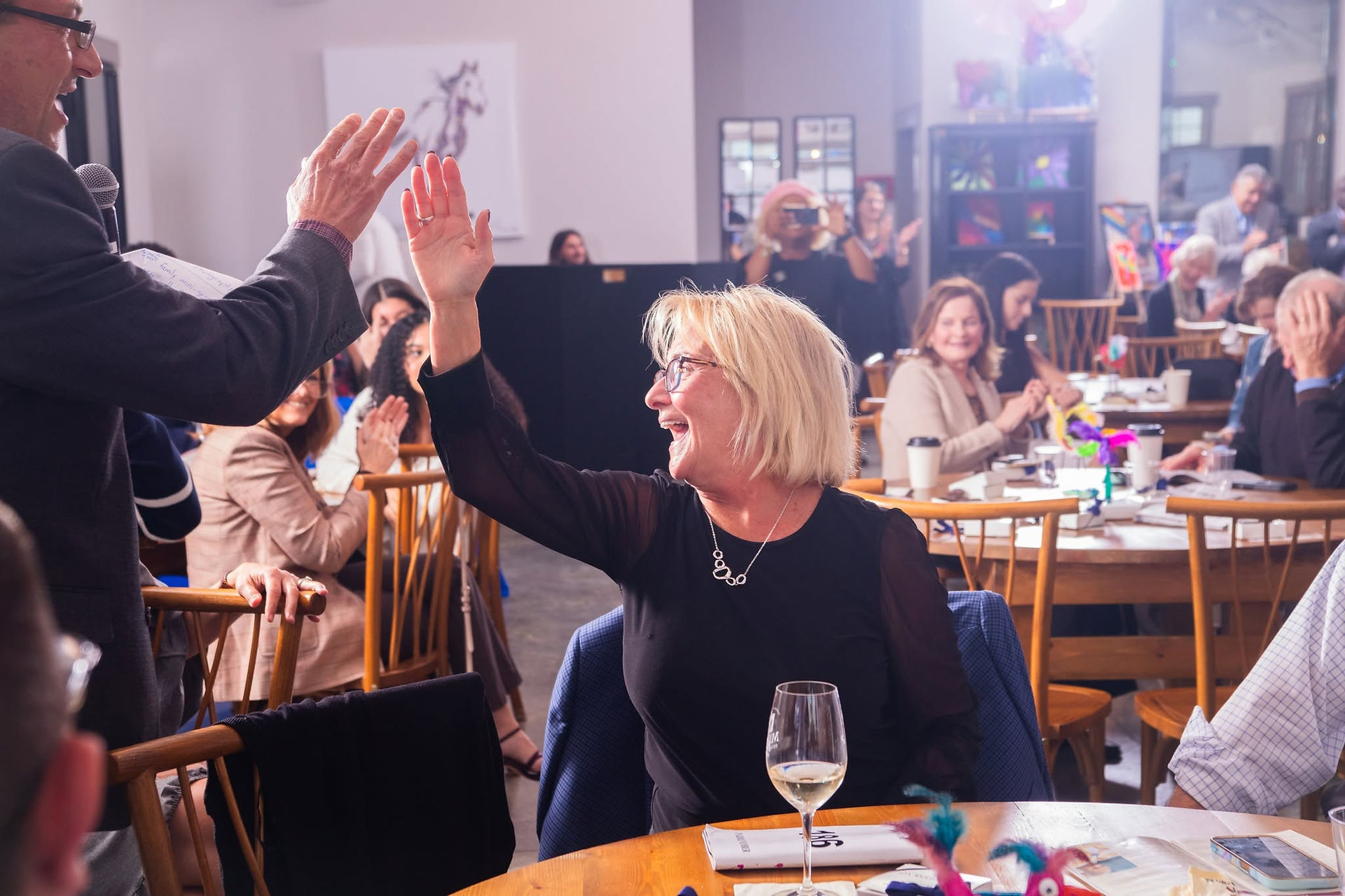 two people high-fiving 