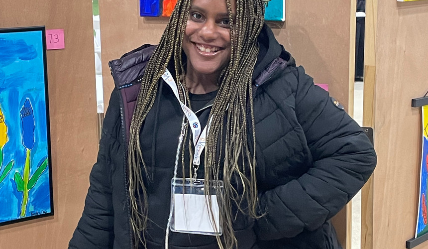Keisha at the NY Alliance Art Show viewing her showcased artwork.