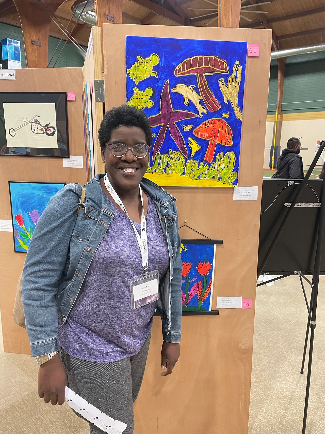 Kendra at the NY Alliance Art Show viewing her showcased artwork.