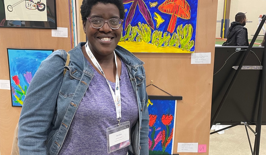 Kendra at the NY Alliance Art Show viewing her showcased artwork.