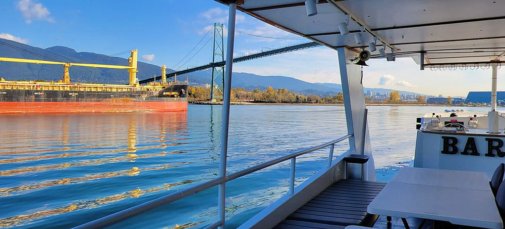 Golden hour reflections from downtown bridge captured during Vancouver cruise