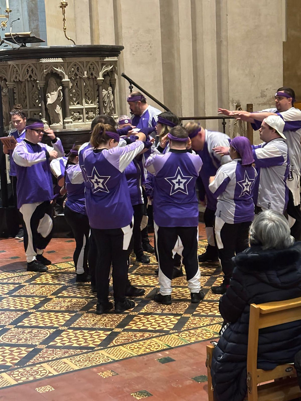 Individuals from Purple All Stars performing dance