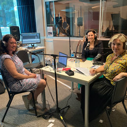Three women in a recording studio