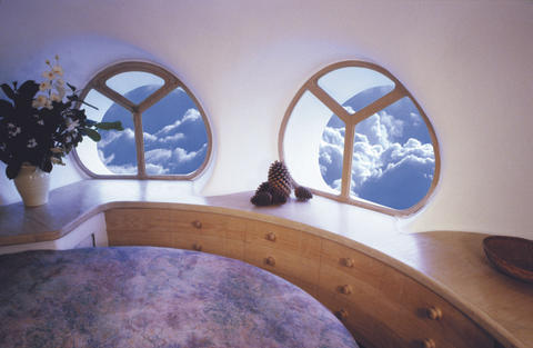 Curved windows over clouds.