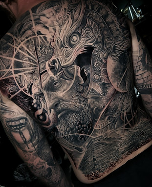 Black and grey surrealism chest tattoo by James Brennan in Liverpool