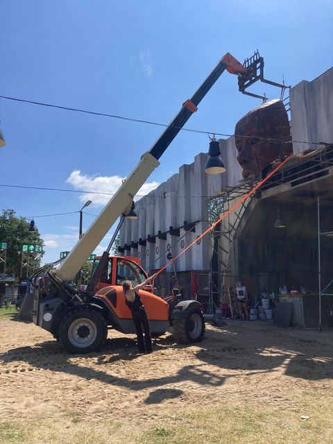 Photo of the poly-carved face being erected front and centre of the Triebwerke stage.