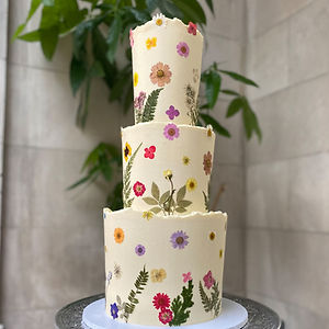 Pressed flower decorated wedding cake