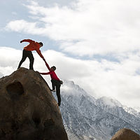 Horizon with Mountain climbers helping e