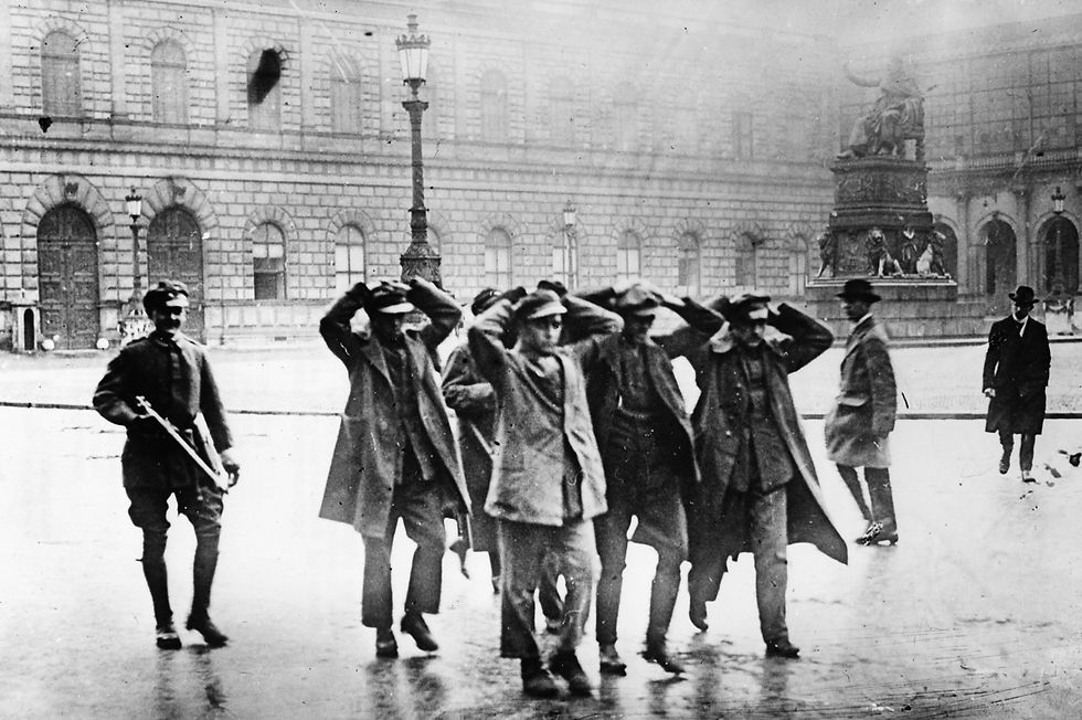 Captured Red combatants are marched through Munich’s Max-Joseph Platz in the spring 1919 after the fall of the Bavarian Soviet Republic. (Public Domain)
