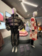 Unisex-gender fluid Floral bomber jacket ensemble by Münn (left) and Long floral jacket and velvet trousers ensemble worn by K-pop band BTS Jin by Kim Seo Riyong. ‘Hallyu: The Korean Wave’ exhibition at the V&A Museum. Picture ⓒR.Lupu for Illustrious Lab