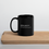 Thumbnail: 11 oz black ceramic mug with funny definition of a golden retriever in classic dictionary format on a wooden cutting board