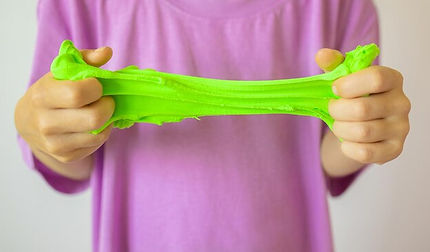 hands-with-green-slime-close-up-trendy-liquid-toy-sticks-hands-kids-hands-playing-slime-to