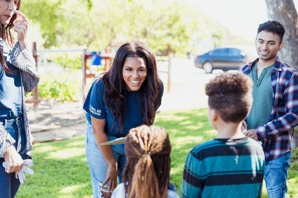 Woman and Man volunteers with kids.jpg