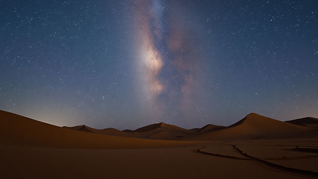 A beautiful desert scene of a nighttime sky full of stars.jpg