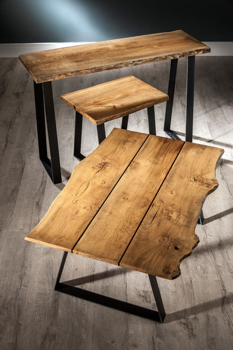 Scottish Elm lamp table with a steel trapezoid base.