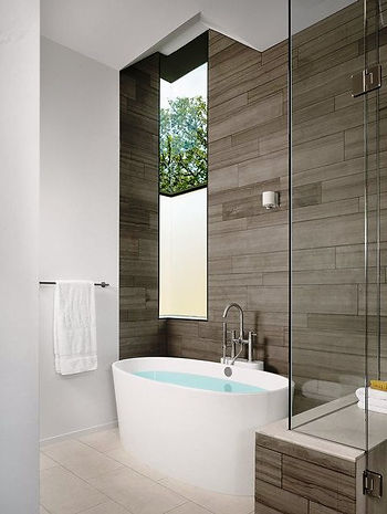 SCM Design Group freestanding tub in wood panel corner