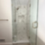 Professional bathroom renovation featuring custom shower niches and glass shower door installation in Chappaqua, NY