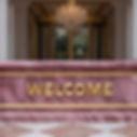 vecteezy_a-welcome-sign-in-an-elegant-hotel-lobby_65366304_edited.jpg