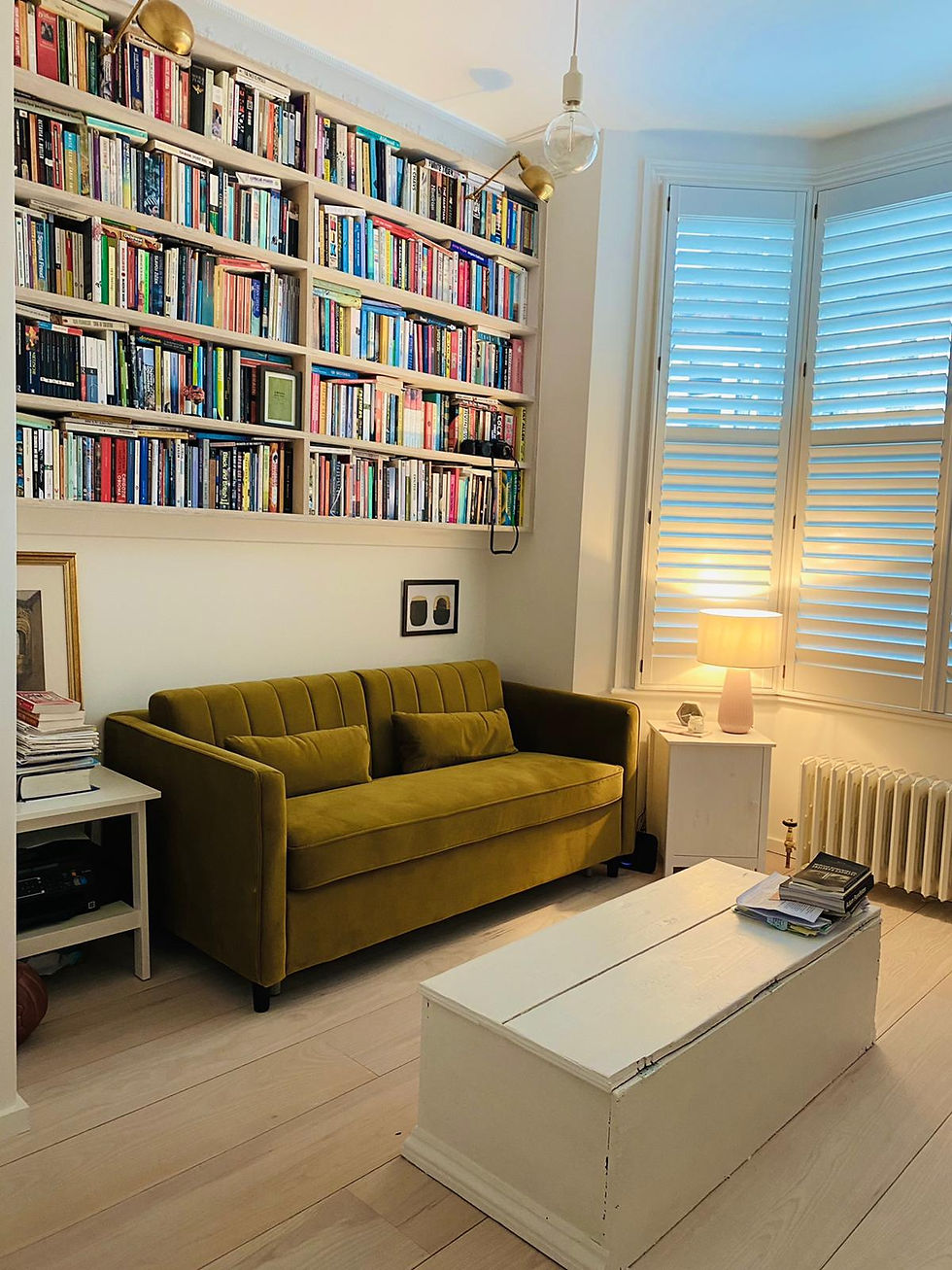 Eye-level view of a modern living room with neutral colours and natural wood accents