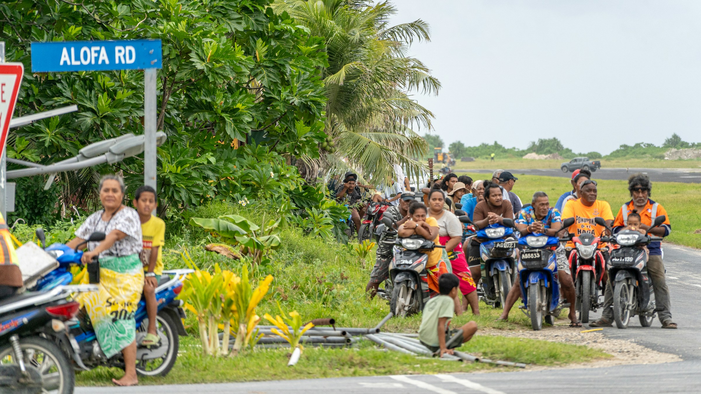 Residents of Funafuti gather along Alofa Road next to the airstrip. Photo: Winston Chen / Unsplash