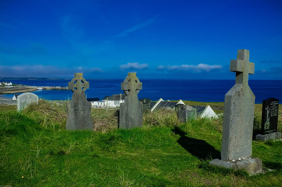 A gorgeous Celtic cemetery sits on a hilltop in Inis Oirr Island, Ireland.