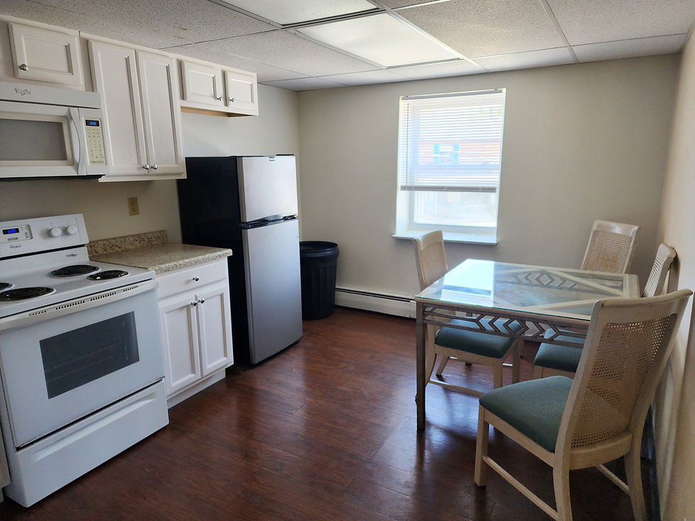 Kitchen with white cabinets, white appliances, wood floor, dining table with chairs, landscape