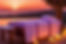a purple sunset with a massage bed hot stones flowers towels and candles lit_edited.jpg
