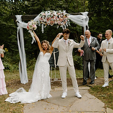 Bride and groom celebrating their marriage at the altar