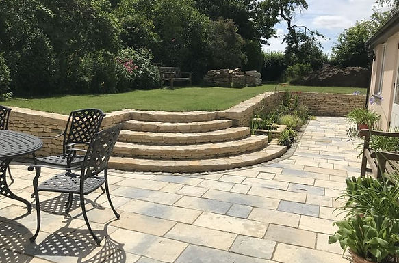 Historic garden at Park End Thatch featuring stone terraces, recycled materials and wildlife-focused planting, creating a richly layered and biodiverse landscape.