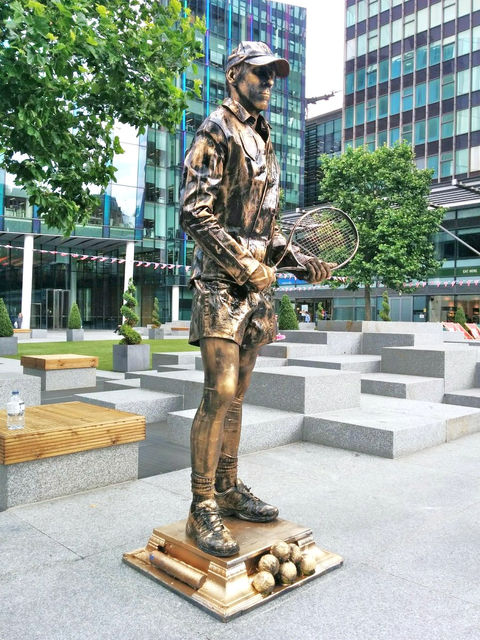 tennis player living statue