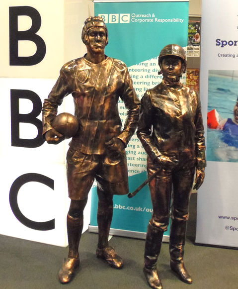 Jockey & Rugby player living statue