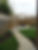 Child-friendly garden redesign with modern paving, planting beds and trellises