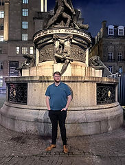 Michael standing next to a water fountain.