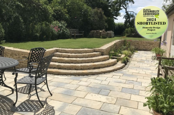 Historic garden at Park End Thatch featuring stone terraces, recycled materials and wildlife-focused planting, creating a layered and biodiverse landscape.