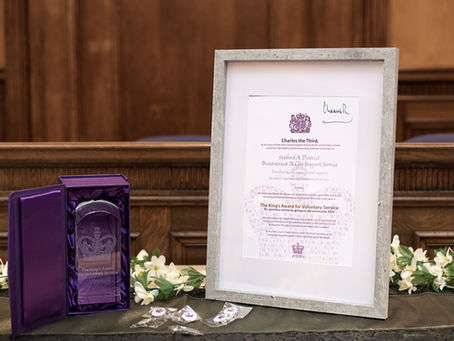 A photo of The Crystal Trophy and signed Certificate by his Majesty the King 