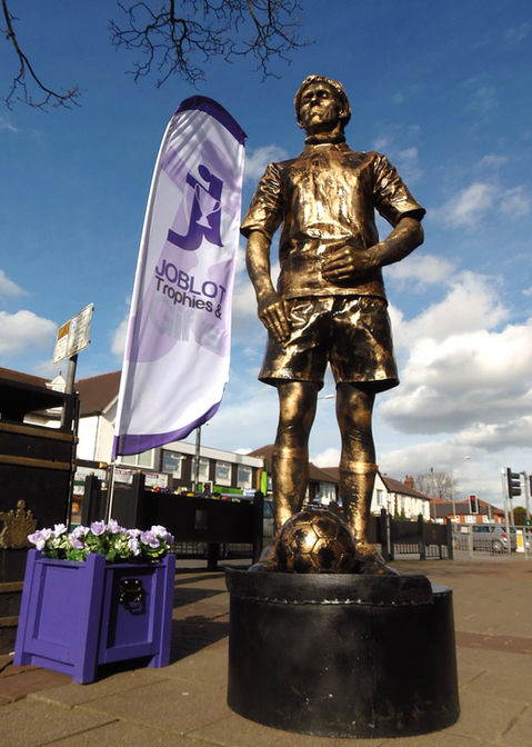 footballer living statue