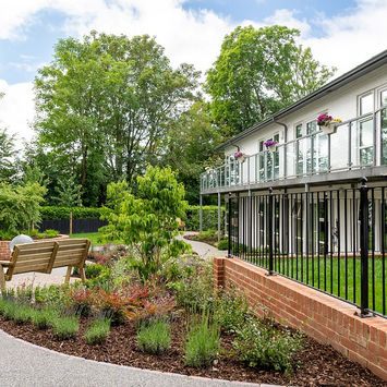 Dementia friendly care home garden by Bramley Apple Garden Design, with accessible paths, sensory planting, seating areas, gazebo and dining terrace.