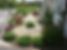 Ex show-home corner garden with coastal-style hard landscaping and hardy planting