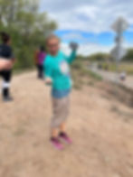 Arlene posing in construction vest and hat