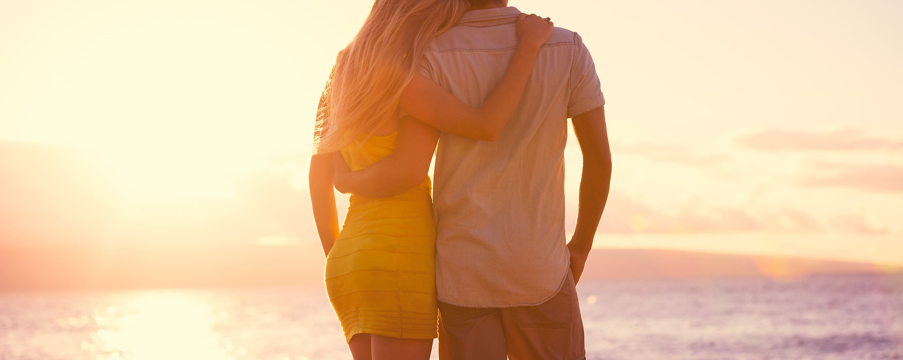 romantic-couple-watching-the-sunset-on-t