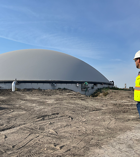biodigester with worker in the front