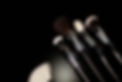 set of brushes for professional makeup on a black background.jpg