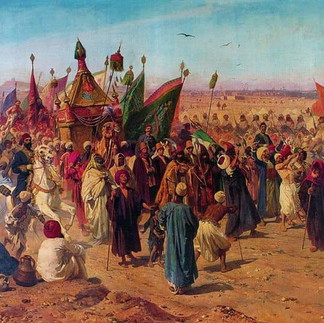 Historical painting of the Surre Alayı showing a large ceremonial procession moving across a desert landscape with crowds of people, mounted figures, banners, and a decorated camel carrying an ornate covered structure. The scene emphasizes the scale, color, and ritual importance of the procession as pilgrims and attendants gather around the caravan.