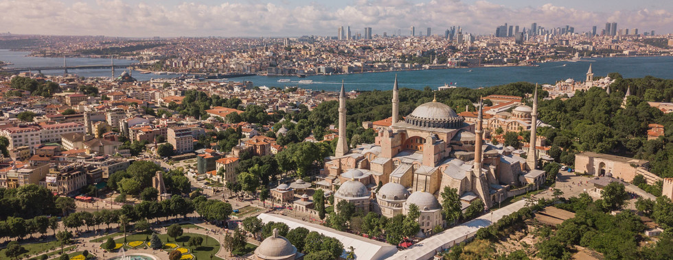Aerial view of Hagia Sophia in Istanbul with the Bosphorus Strait and city skyline in the background