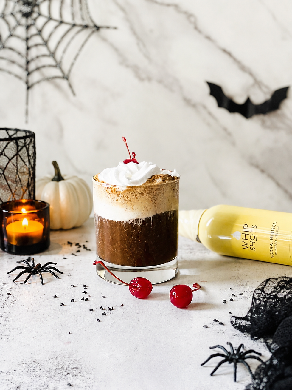 Cozy Halloween hot chocolate with festive toppings and mug rim garnish