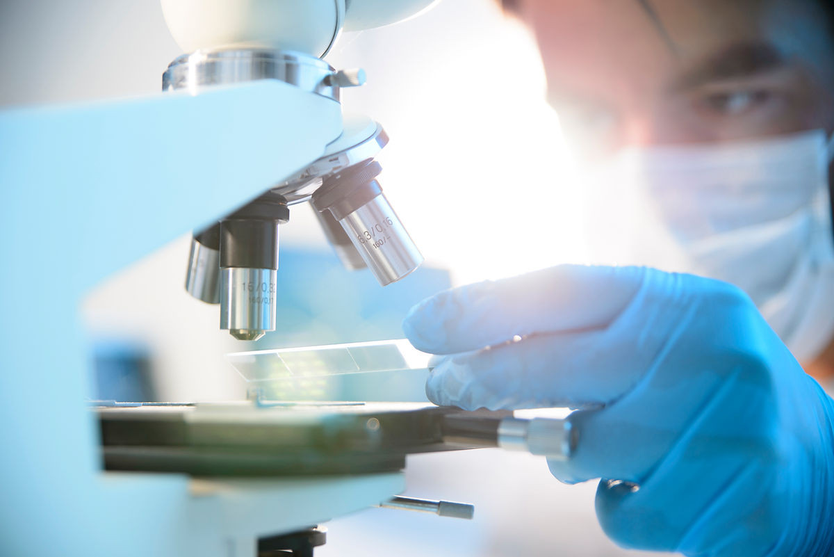 Scientist Using Microscope