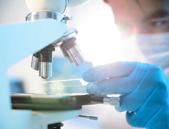Scientist Using Microscope