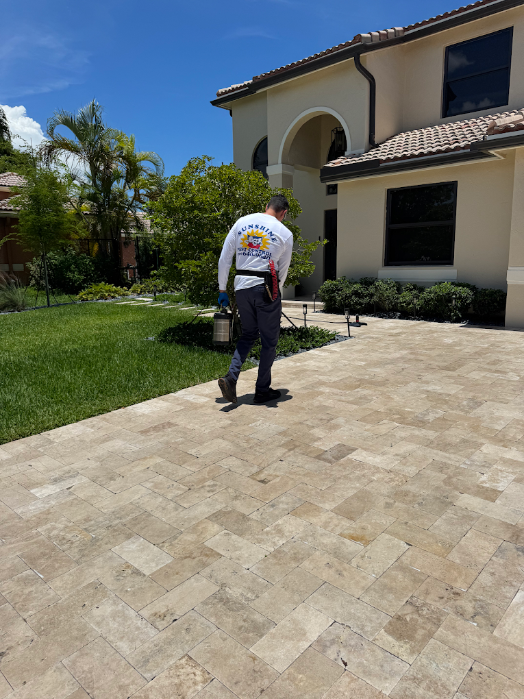 Home pest control treatment at a South Florida home entrance