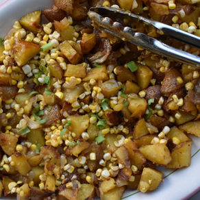 Sweet roasted potatoes with corn, spices and honey, summer salad