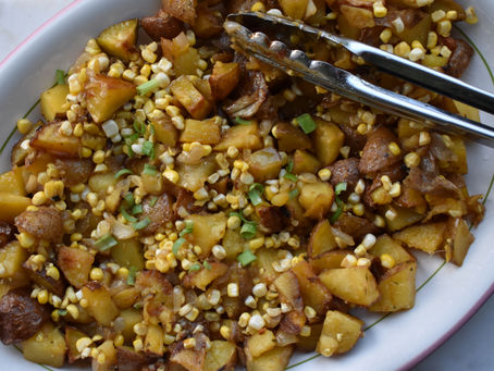 Sweet roasted potatoes with corn, spices and honey, summer salad